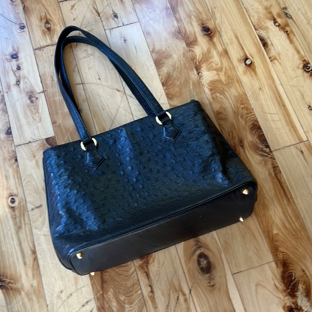 Black leather shoulder bag with zipper closure